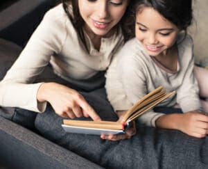 Mother and child reading a book